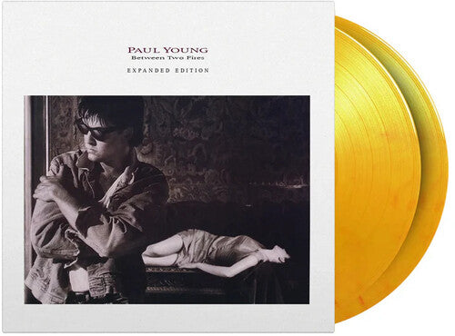 Paul Young: Between Two Fires - Limited & Expanded 180-Gram Flame Colored Vinyl { Vinyl }